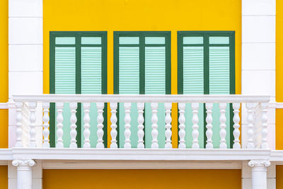 Close-up of yellow windows in building