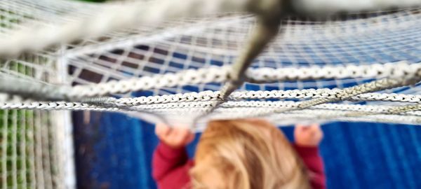 Preschool age boy playing in soccer field