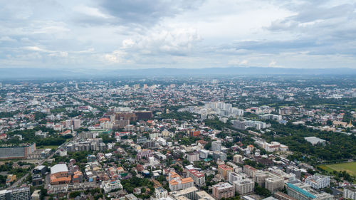 Aerial view of cityscape against sky