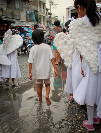 Woman standing by railing