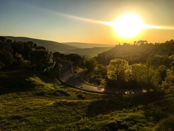 Scenic view of landscape against sky during sunset