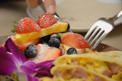 Cropped image of person having food