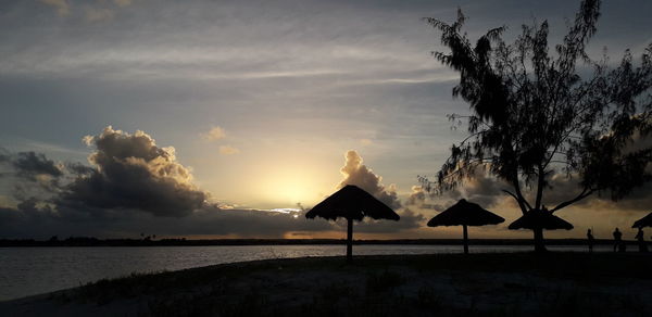 Scenic view of beach against sky during sunset