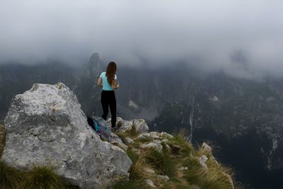 Full length of woman looking at mountains