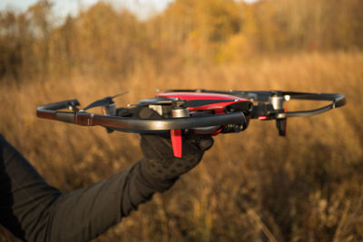 Close-up of person holding drone