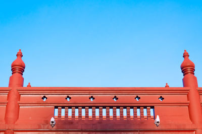 Low angle view of building against clear blue sky