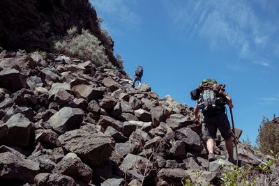 Low angle view of rock formation against sky