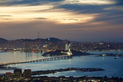 High angle view of illuminated city at waterfront