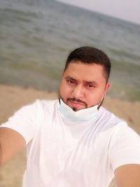 Portrait of young man on beach