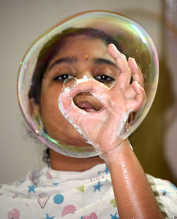 Close-up portrait of a girl with bubbles