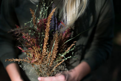 Close-up of hand holding plant