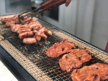 High angle view of meat on barbecue grill