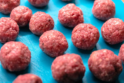 High angle view of meatballs on blue table