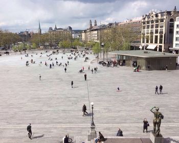 People at town square against sky