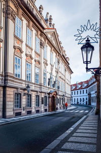 Narrow road along built structures