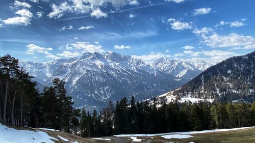 Scenic view of snowcapped mountains against sky