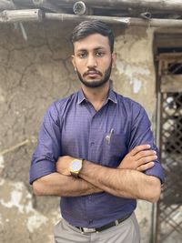 Portrait of young man standing outdoors