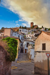 Buildings in town against sky