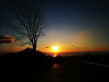 Silhouette of road during sunset