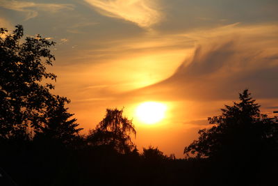 Low angle view of silhouette trees against sky during sunset