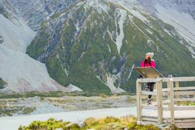 Woman on mountain range