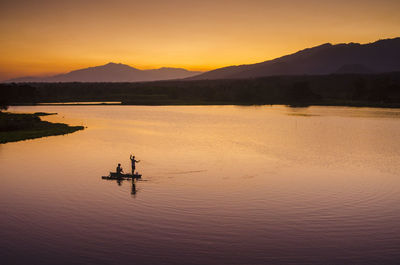 Scenic view of silhouette mountain against sky during sunset