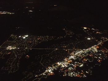 Aerial view of illuminated cityscape at night