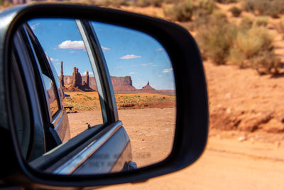 Reflection of sky on side-view mirror