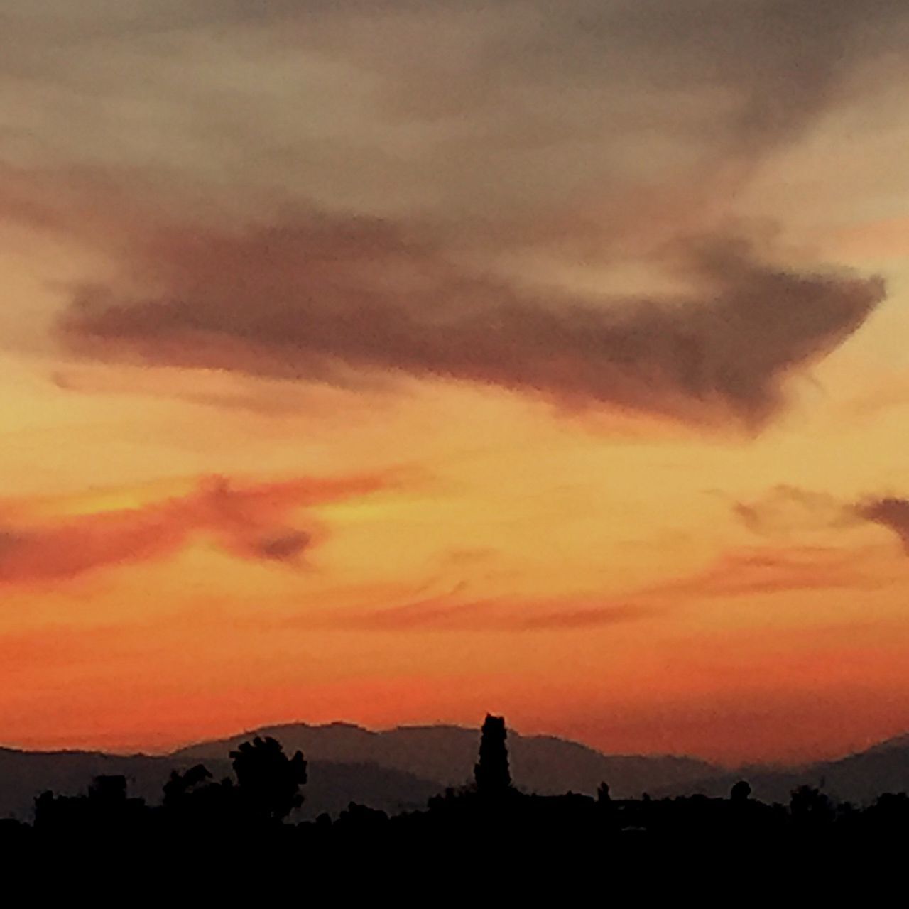 sunset, silhouette, sky, orange color, scenics, beauty in nature, cloud - sky, tranquil scene, tranquility, mountain, nature, idyllic, building exterior, dramatic sky, built structure, architecture, cloud, landscape, outdoors, majestic