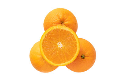 Close-up of orange fruit against white background