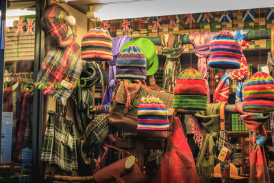 Multi colored hats for sale at market stall
