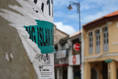 Low angle view of text on building