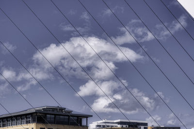 Low angle view of cables against sky