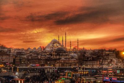 View of buildings in city at sunset