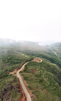 Scenic view of road amidst landscape against sky