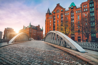 View of bridge over canal against buildings