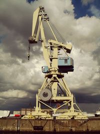 Low angle view of building against cloudy sky