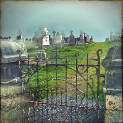 View of fence on riverbank