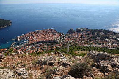 High angle view of townscape by sea