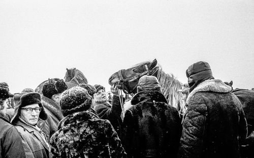 Rear view of people against clear sky