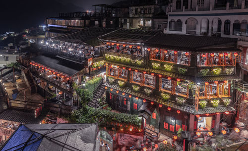 High angle view of illuminated buildings at night