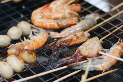 Close-up of meat on barbecue grill