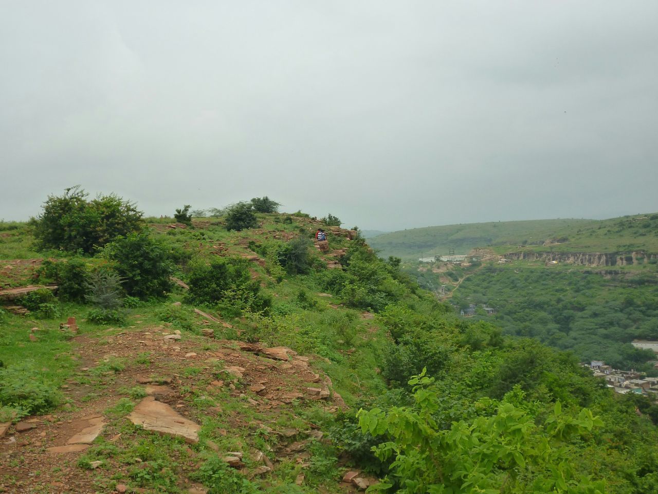 tree, tranquil scene, landscape, scenics, tranquility, growth, mountain, sky, green color, non-urban scene, beauty in nature, hill, travel destinations, nature, cloud - sky, tourism, plant, remote, outdoors, day, valley, physical geography, rural scene, solitude, countryside, no people, green, wide shot, lush foliage, vacations