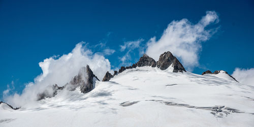 View of snow covered mountains against sky