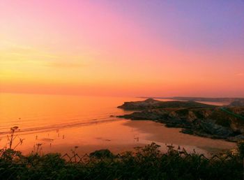 Scenic view of sea at sunset