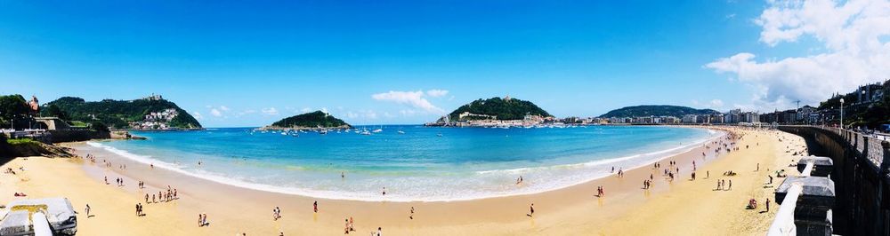 Panoramic view of beach against blue sky