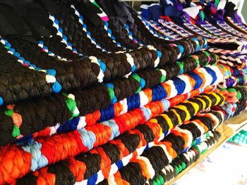 Stack of doormats for sale at market stall