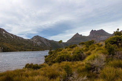 Scenic view of lake and mountains against sky