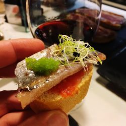 Close-up of cropped hand holding ice cream