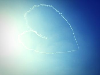 Low angle view of vapor trails in sky